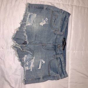Light blue jean shorts. Ripped
